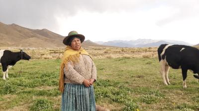 Woman stands on a grass plain
