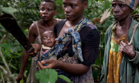 Woman with baby in the jungle